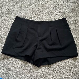 Black pleated shorts